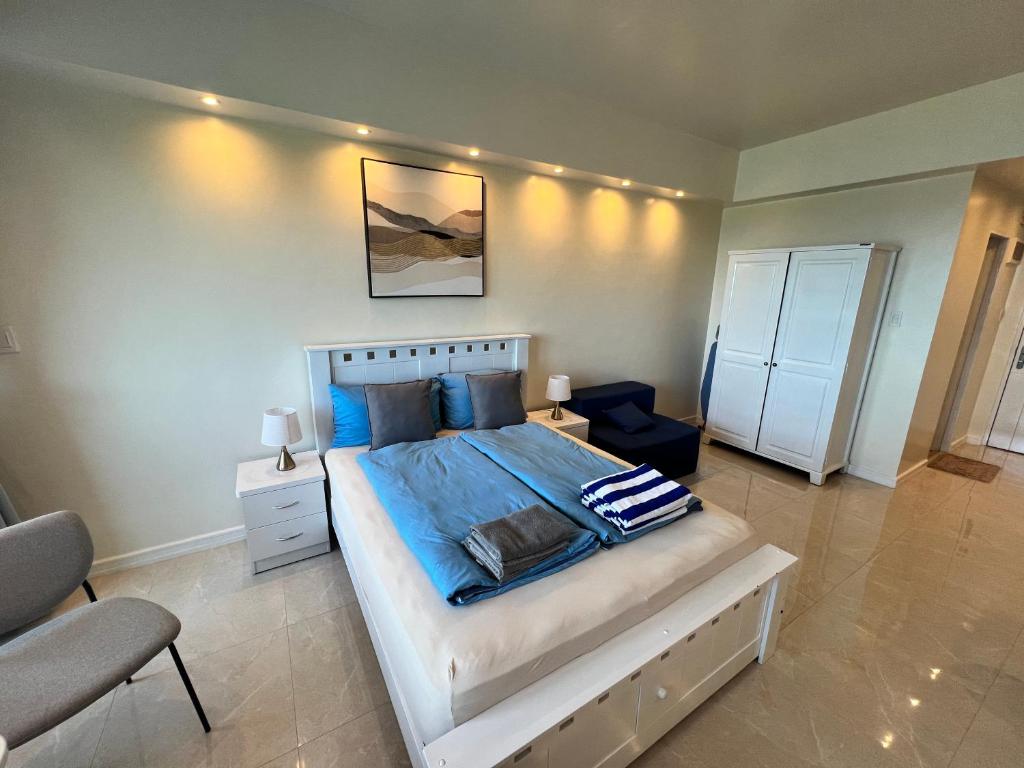 Postel nebo postele na pokoji v ubytování La Mirada Residences Sea-view Suites