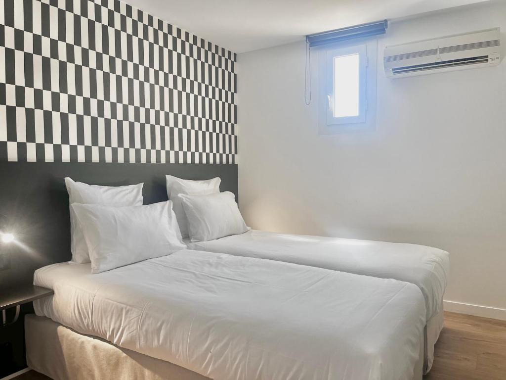 Postel nebo postele na pokoji v ubytování Le Prose Hôtel
