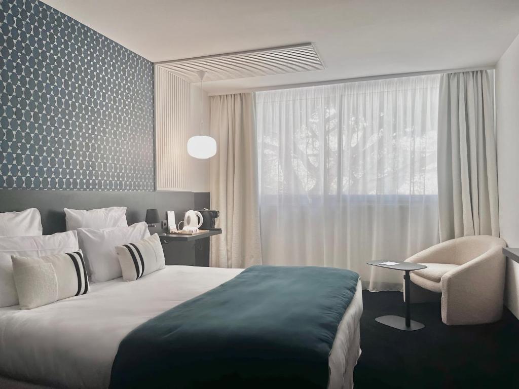 Postel nebo postele na pokoji v ubytování Le Prose Hôtel