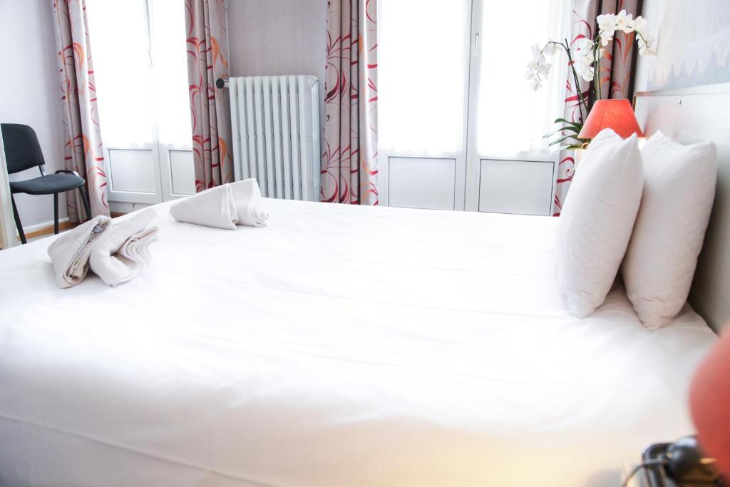 Postel nebo postele na pokoji v ubytování Hôtel De Bale