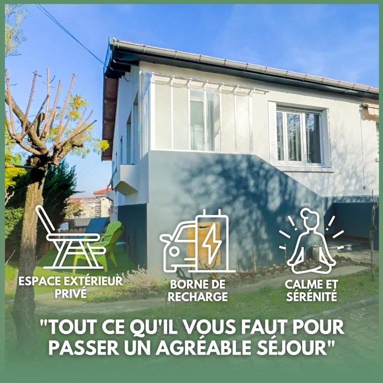 a sign in front of a building with a house at Serenity LAMAISON 1 in Vénissieux