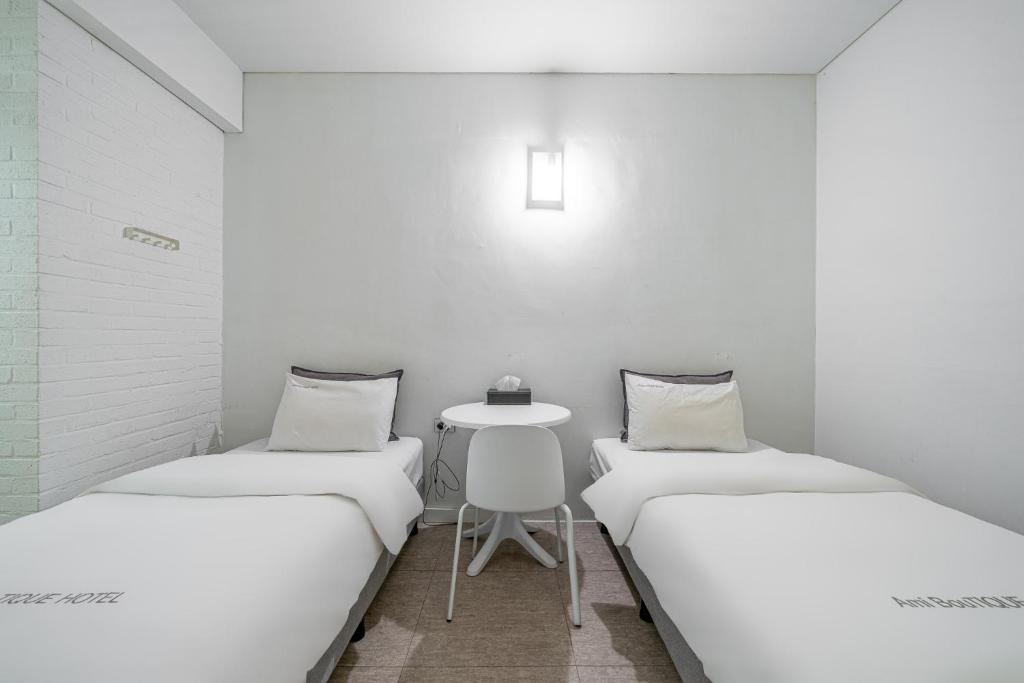 Postel nebo postele na pokoji v ubytování Ami Boutique Hotel, Yongin