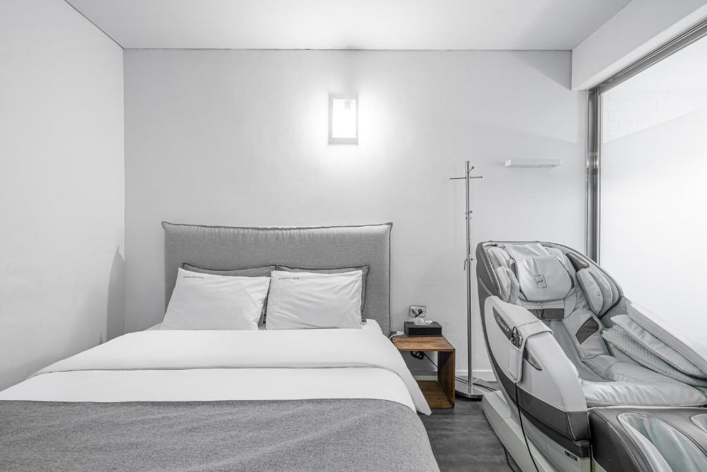 Postel nebo postele na pokoji v ubytování Ami Boutique Hotel, Yongin