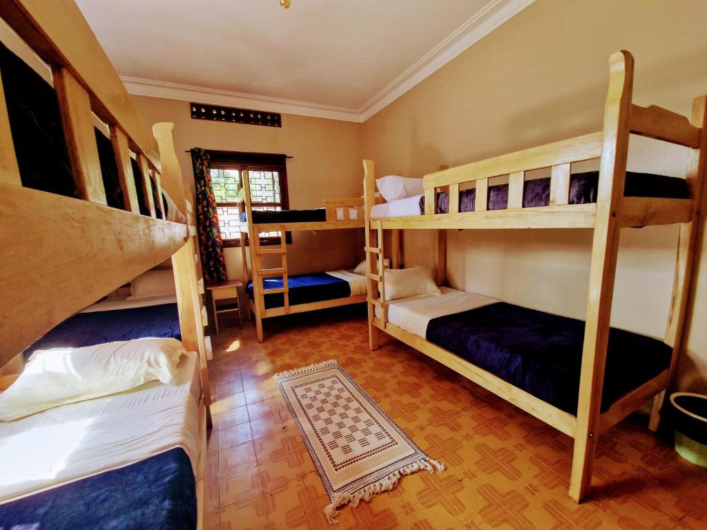 Postel nebo postele na pokoji v ubytování Ubuntu Hivve Hostel