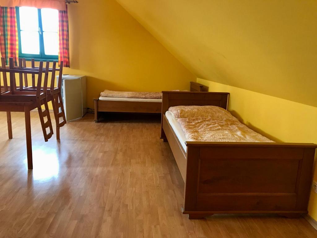 Postel nebo postele na pokoji v ubytování Vinařský dům Sedlec
