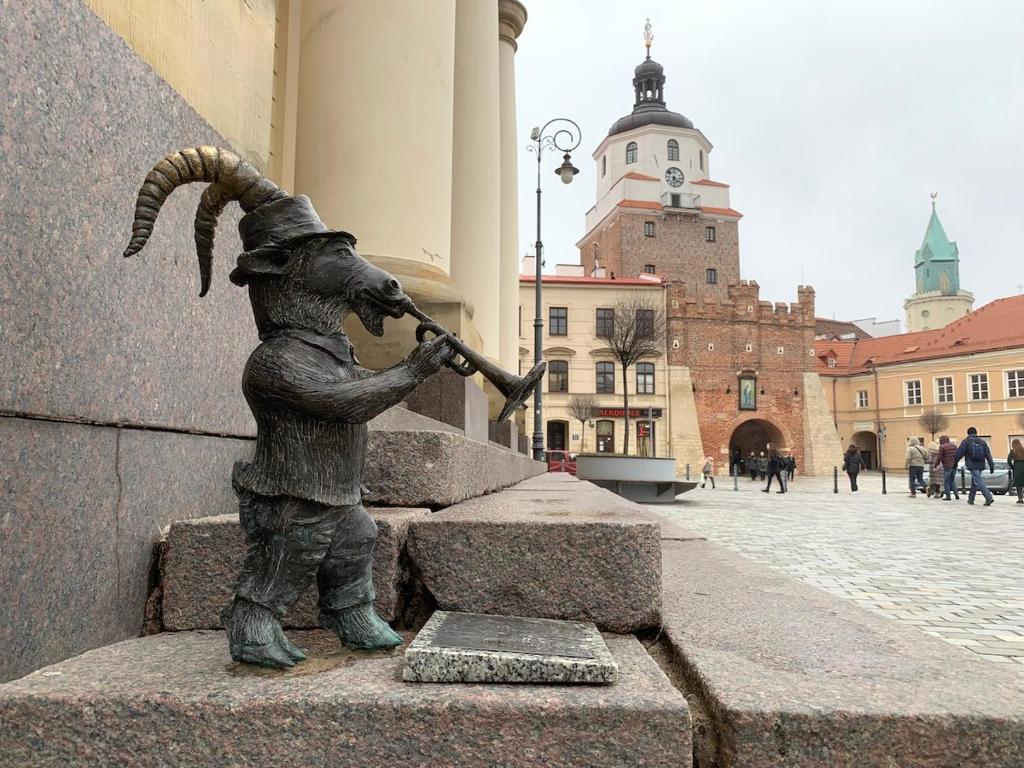 a statue of a rabbit playing a trumpet at Staszica Centrum in Lublin