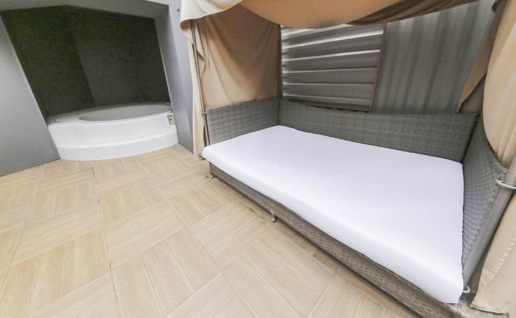 Postel nebo postele na pokoji v ubytování Ami Boutique Hotel, Yongin