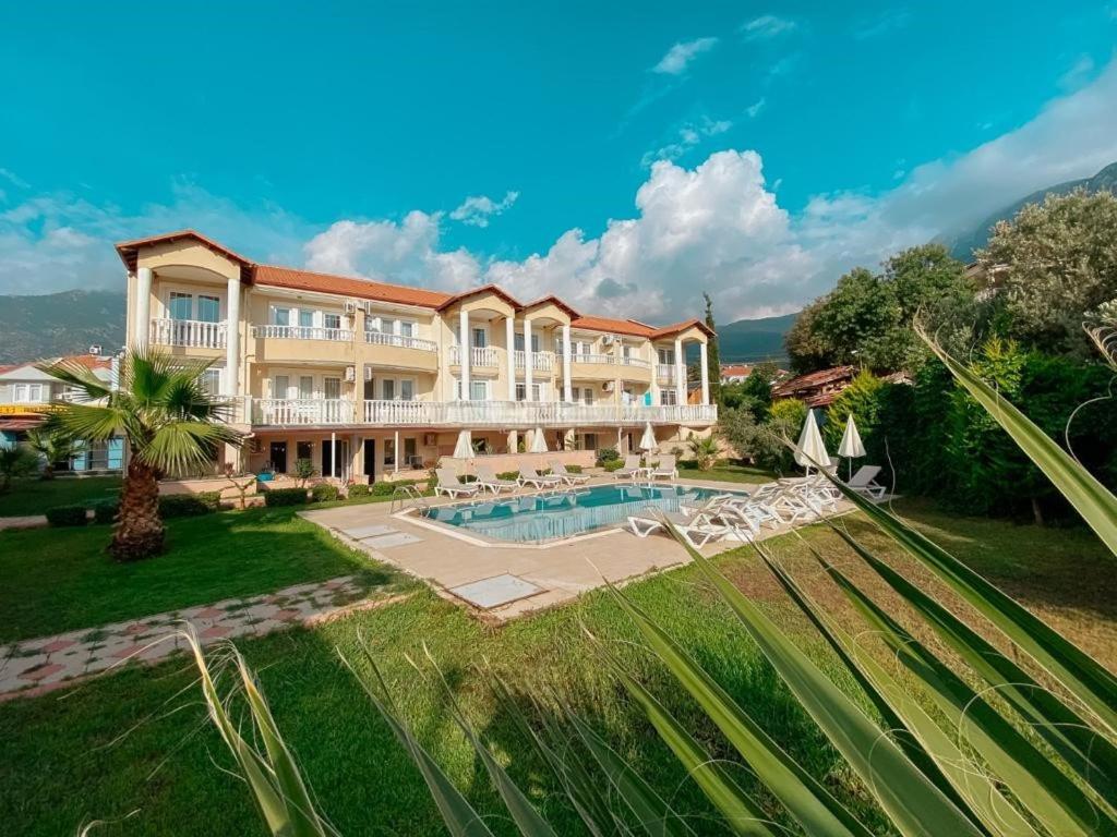 an aerial view of a resort with a swimming pool at Ng Hisar Apart Hotel in Fethiye