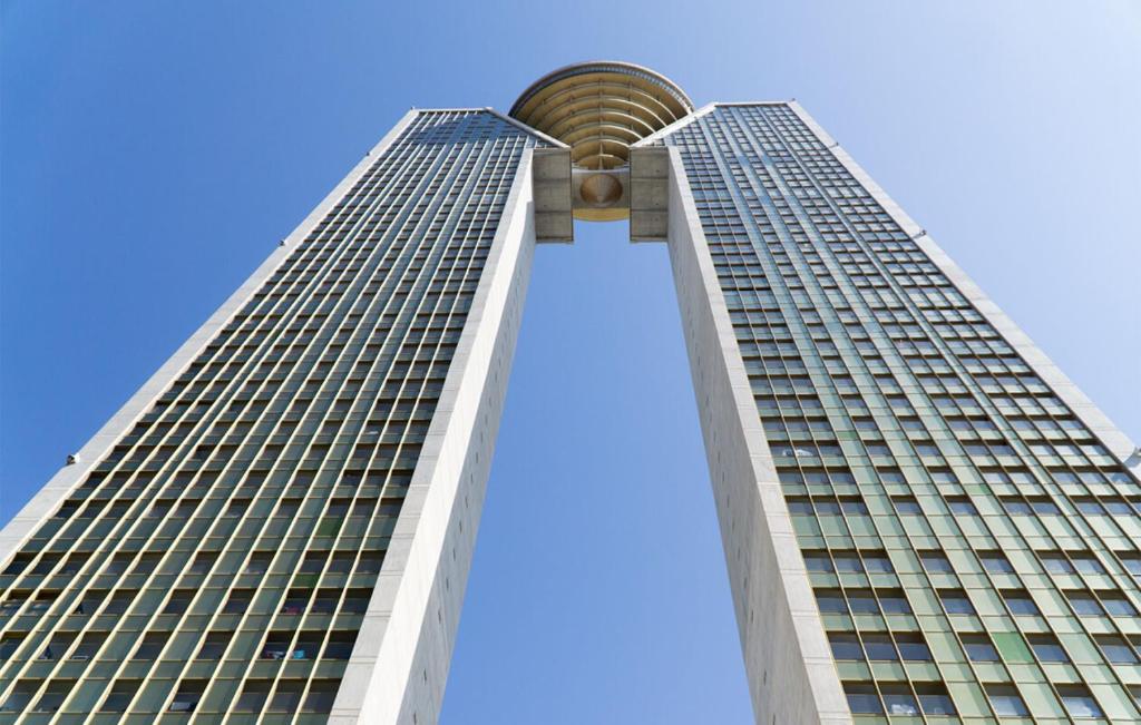 a tall building with a blue sky in the background at Intempo Apartment 2F by VivaMar in Benidorm