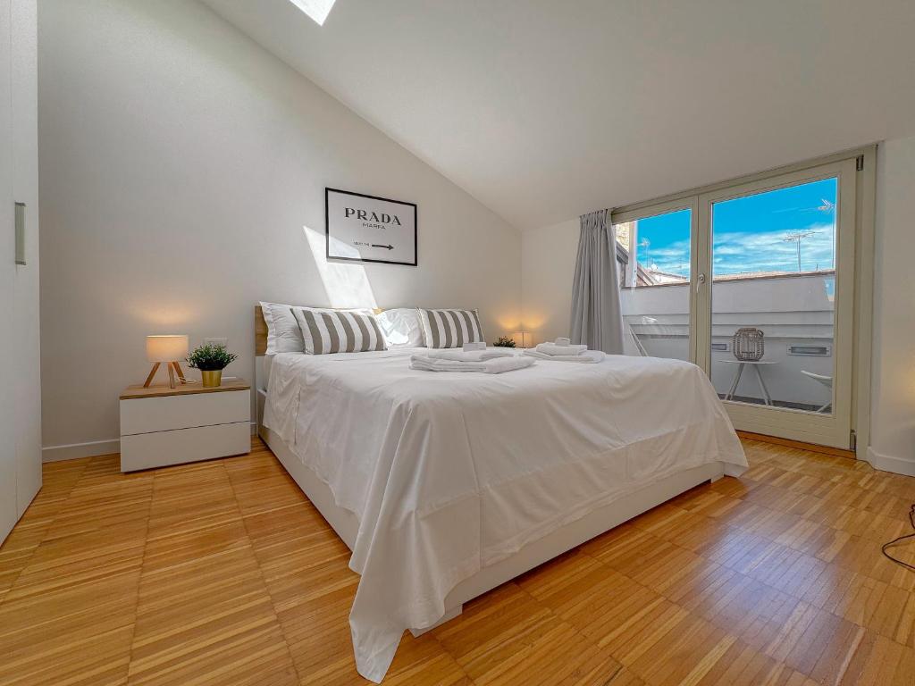 Postel nebo postele na pokoji v ubytování Borgo Loft - Design & Comfort by Host Hero