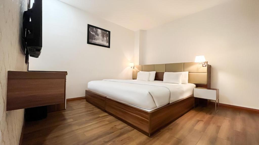 Posteľ alebo postele v izbe v ubytovaní A25 Hotel - 29 Lê Thị Hồng Gấm