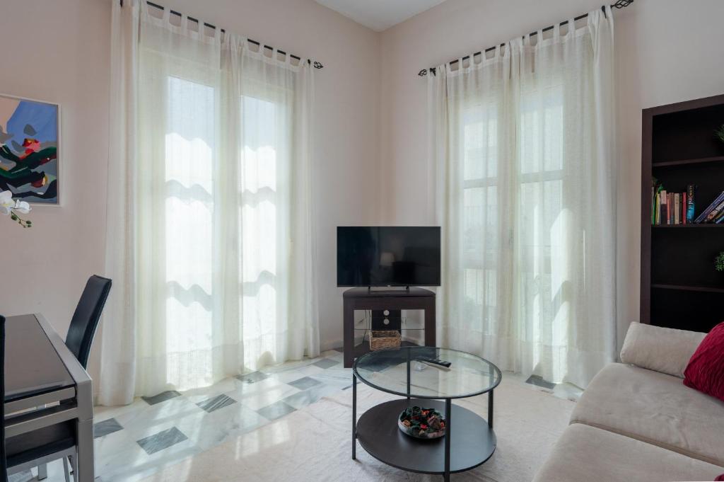 Televízia a/alebo spoločenská miestnosť v ubytovaní San Julian Apartment