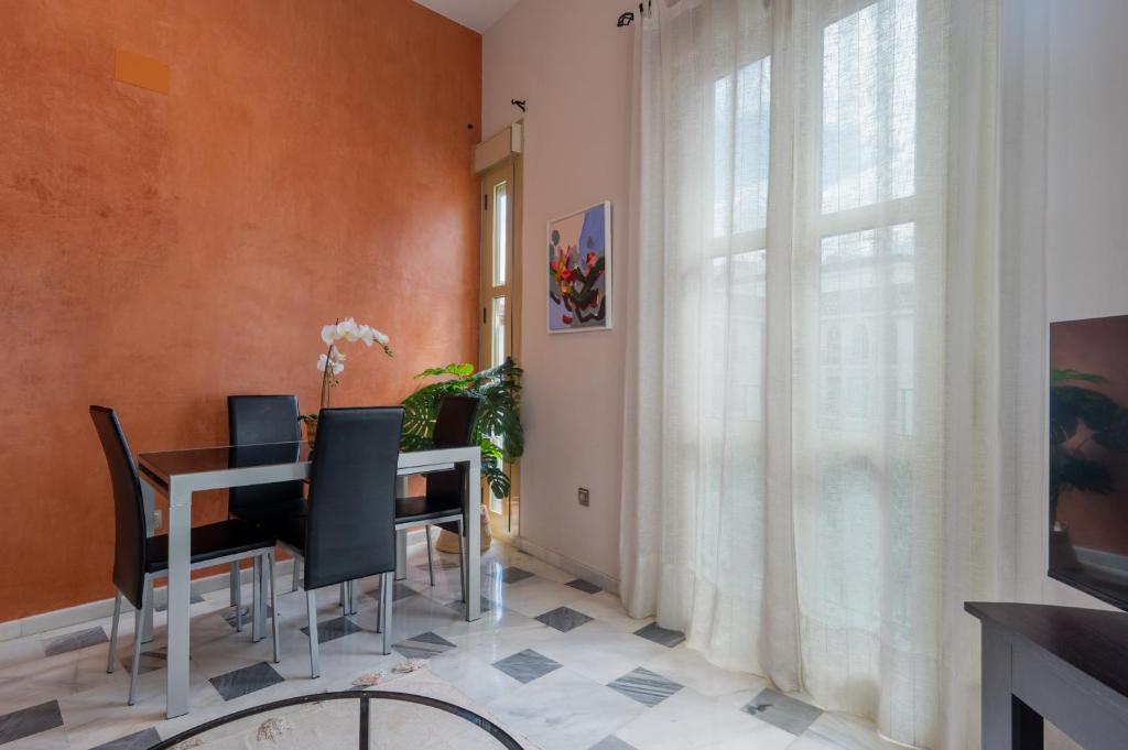 Televízia a/alebo spoločenská miestnosť v ubytovaní San Julian Apartment