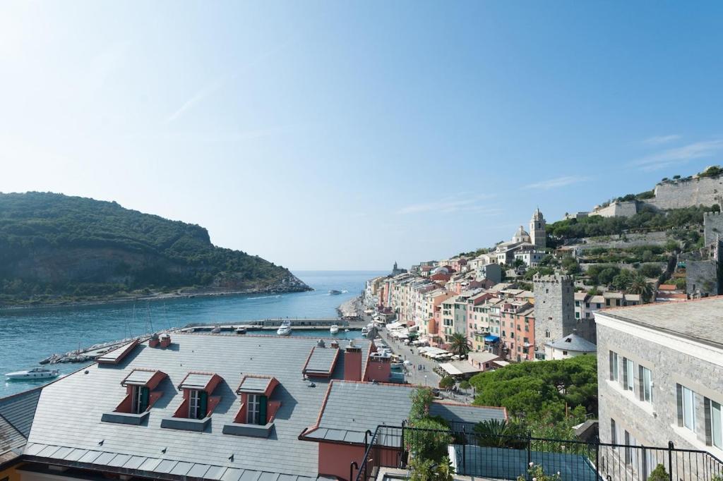 a view of a city with a river and buildings at Appartamento fronte mare in Portovenere