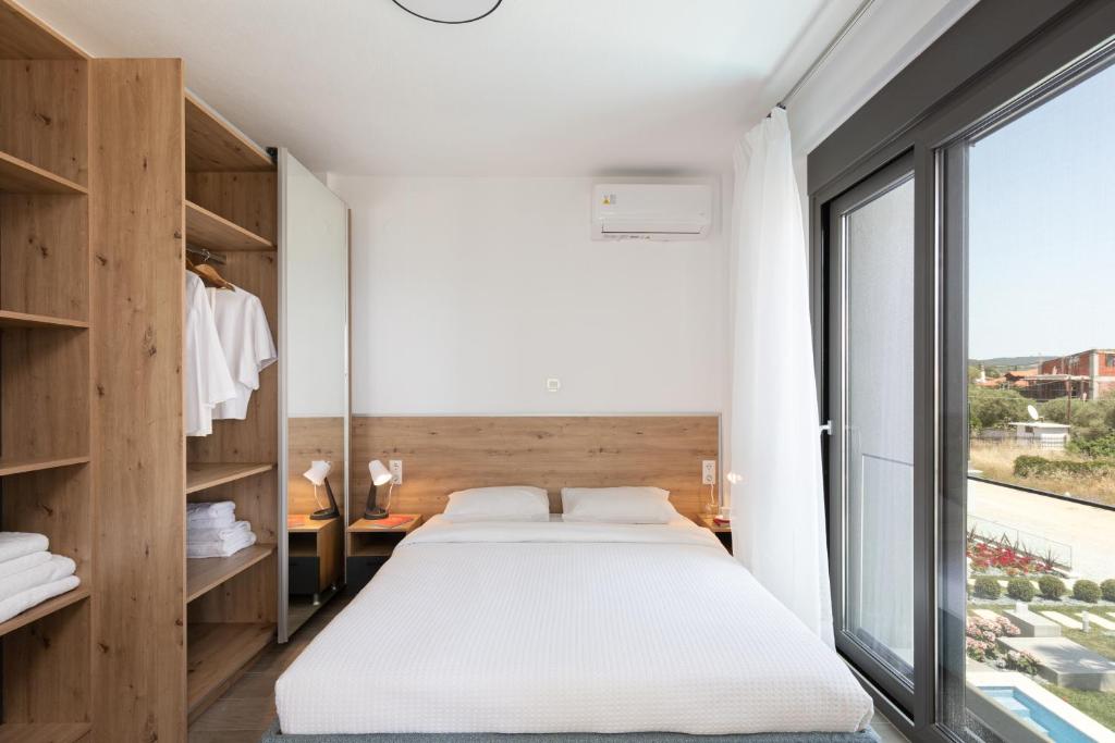 Postel nebo postele na pokoji v ubytování Sea Residence Complex