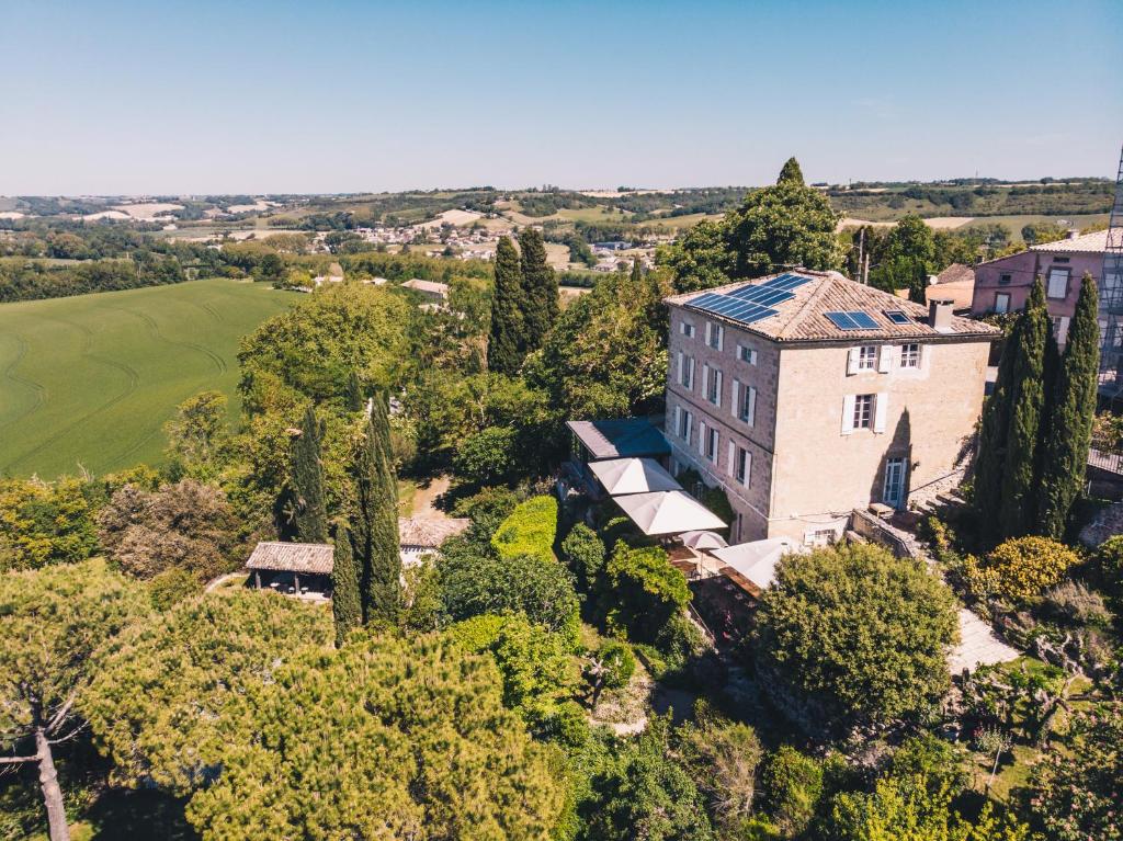 an aerial view of a house with trees at Cuq en Terrasses in Cuq-Toulza