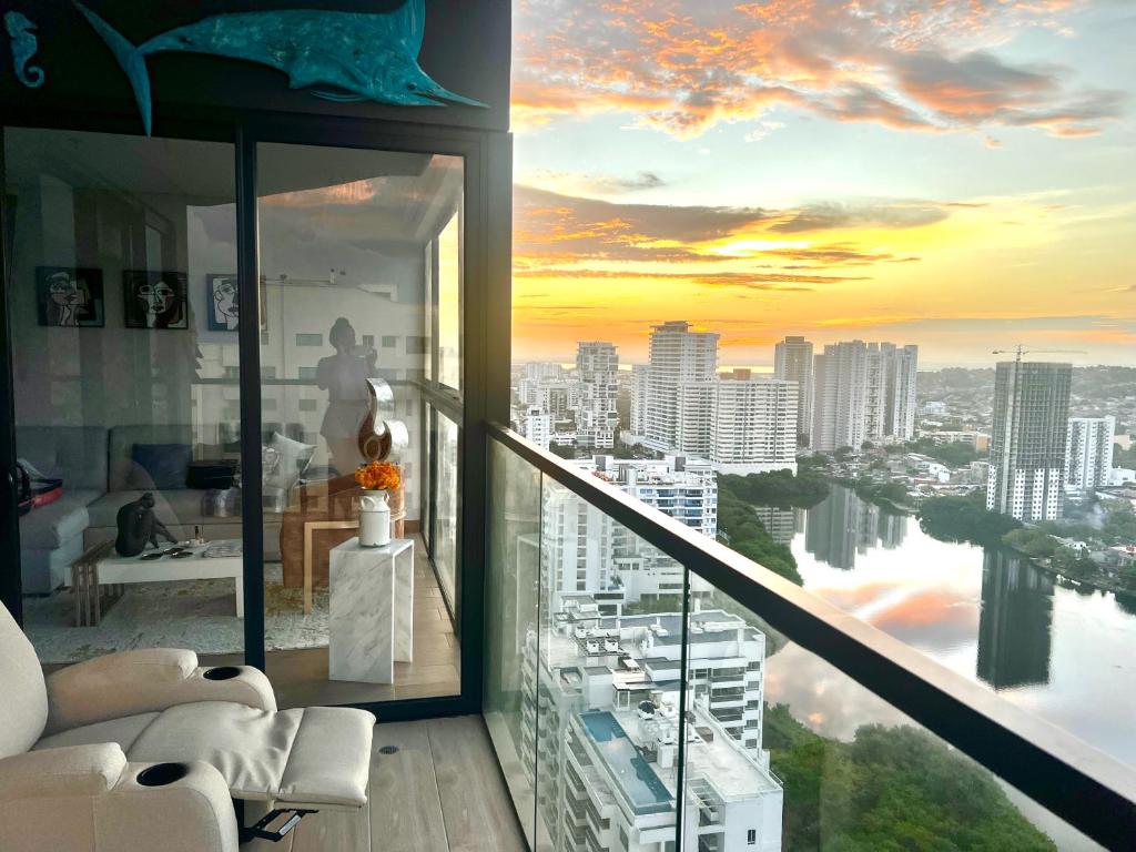 a living room with a view of a city at Murano centro 1 - 25 Floor byIMZ in Cartagena de Indias
