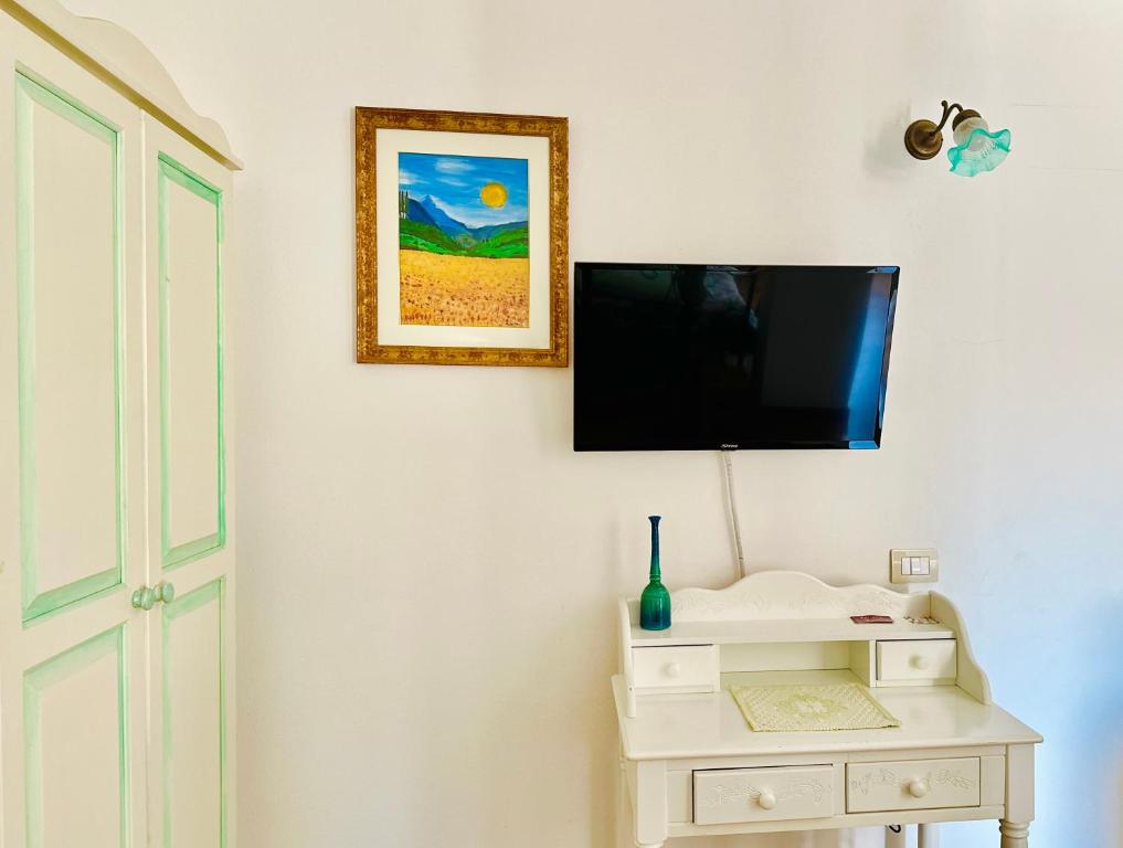 TV a/nebo společenská místnost v ubytování B&B Tre - Rooms & Relax