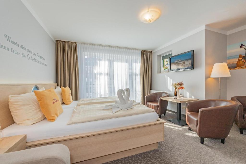 Postel nebo postele na pokoji v ubytování Aparthotel Strandhus