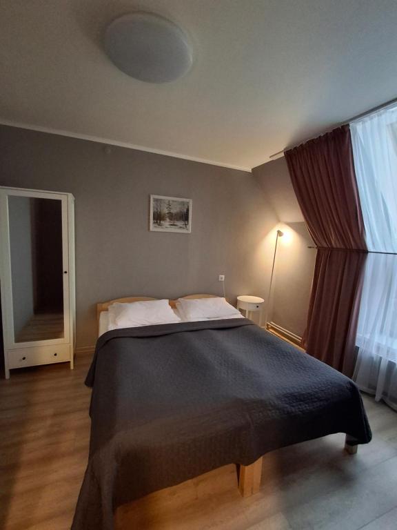 Postel nebo postele na pokoji v ubytování Hotel Melturi