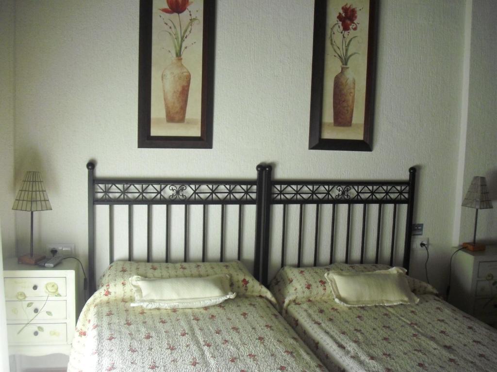 Postel nebo postele na pokoji v ubytování La Posada de Menchu