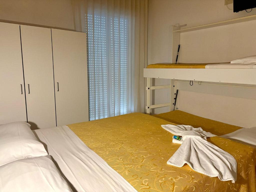 Postel nebo postele na pokoji v ubytování Hotel Sport
