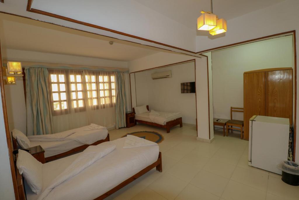 Postel nebo postele na pokoji v ubytování Acacia Dahab Hotel