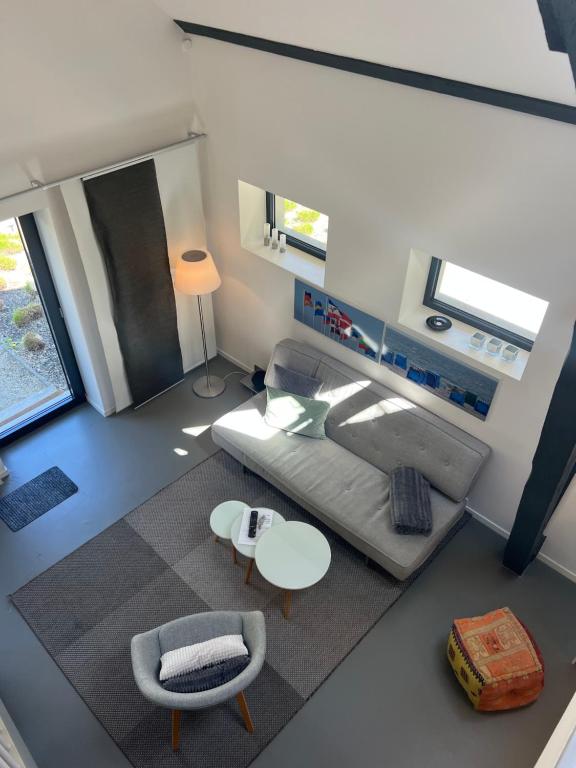 Postel nebo postele na pokoji v ubytování HAUS DOHRMANN - mit direktem Strandzugang,moderne, ruhig gelegene Ferienwohnungen mit Terrasse