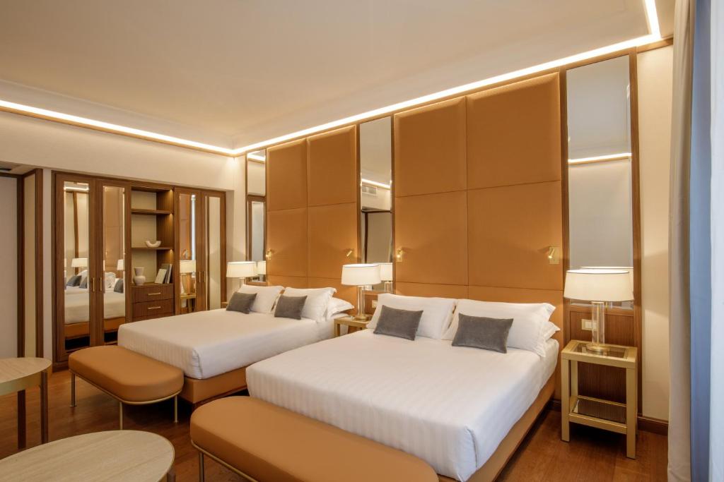 Postel nebo postele na pokoji v ubytování Hotel Imperiale by OMNIA hotels