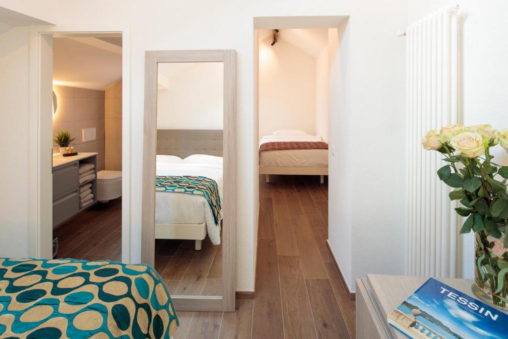 Postel nebo postele na pokoji v ubytování Hotel America
