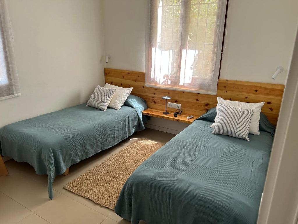 Postel nebo postele na pokoji v ubytování La Coma Sa Riera