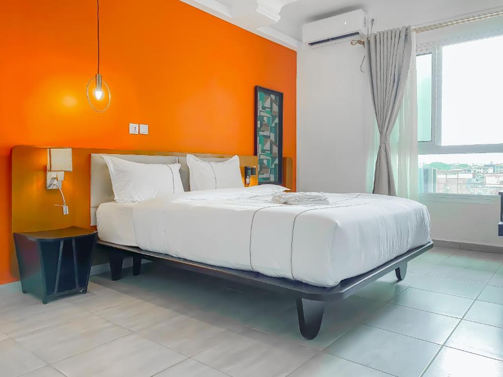 Postel nebo postele na pokoji v ubytování MANOU HOTEL