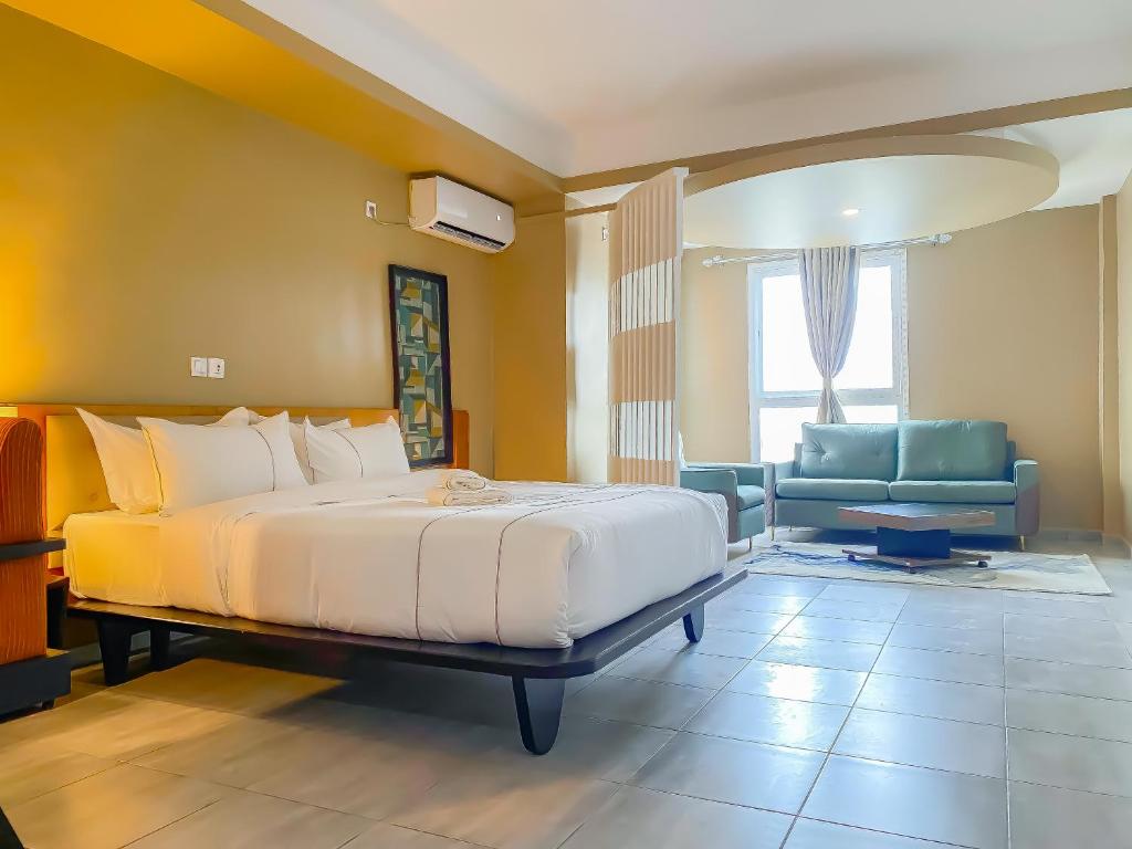 Postel nebo postele na pokoji v ubytování MANOU HOTEL