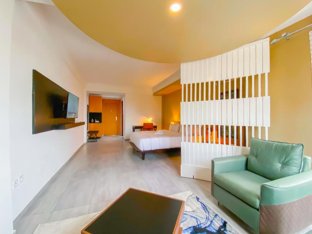 Postel nebo postele na pokoji v ubytování MANOU HOTEL
