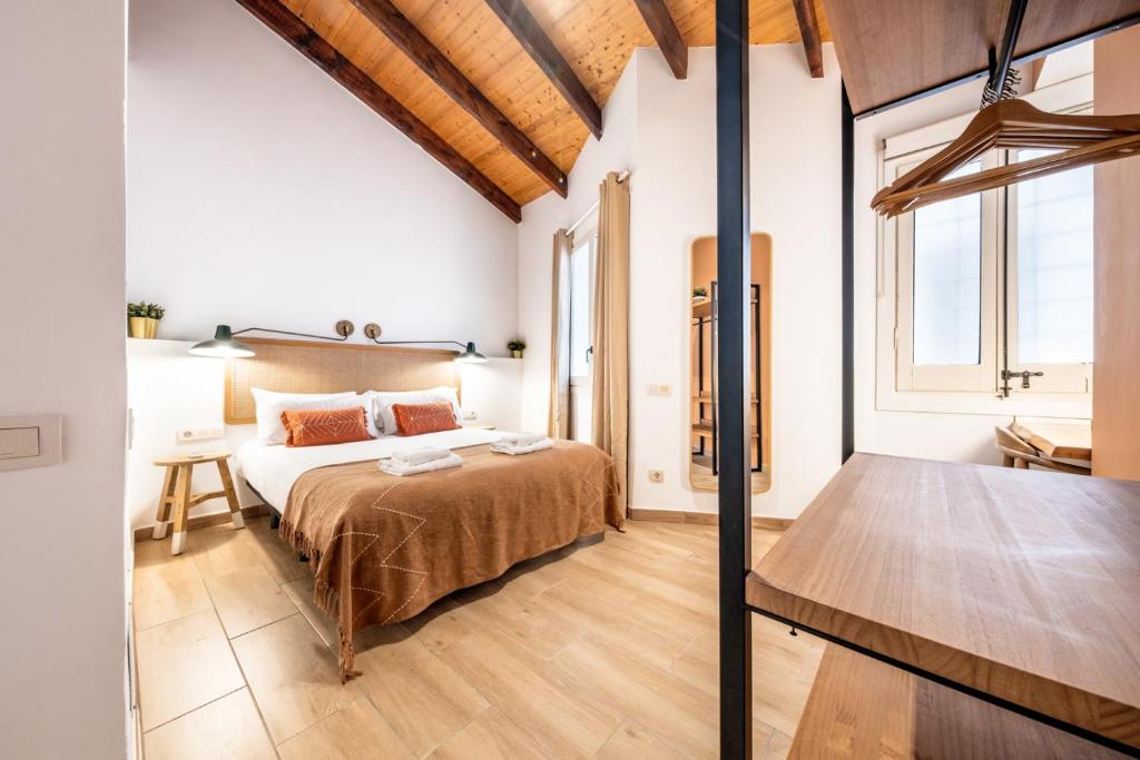 Posteľ alebo postele v izbe v ubytovaní Caliu Apartments Barcelona - Fira