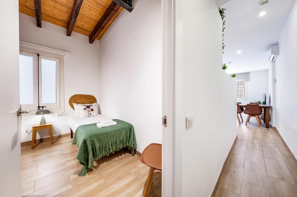 Posteľ alebo postele v izbe v ubytovaní Caliu Apartments Barcelona - Fira