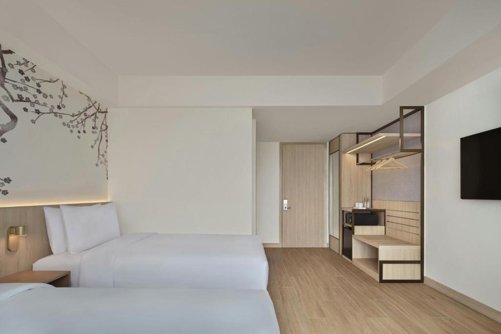 Postel nebo postele na pokoji v ubytování Fairfield by Marriott Bekasi