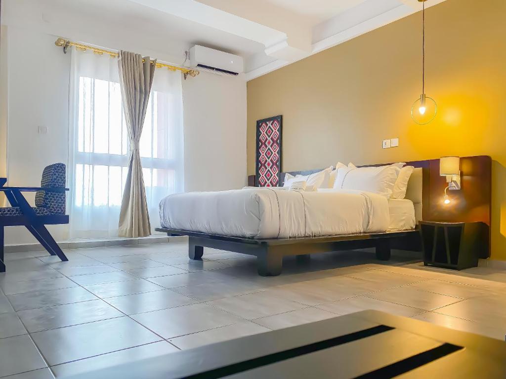 Postel nebo postele na pokoji v ubytování MANOU HOTEL