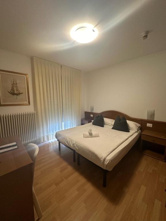 Postel nebo postele na pokoji v ubytování Athos Hotel