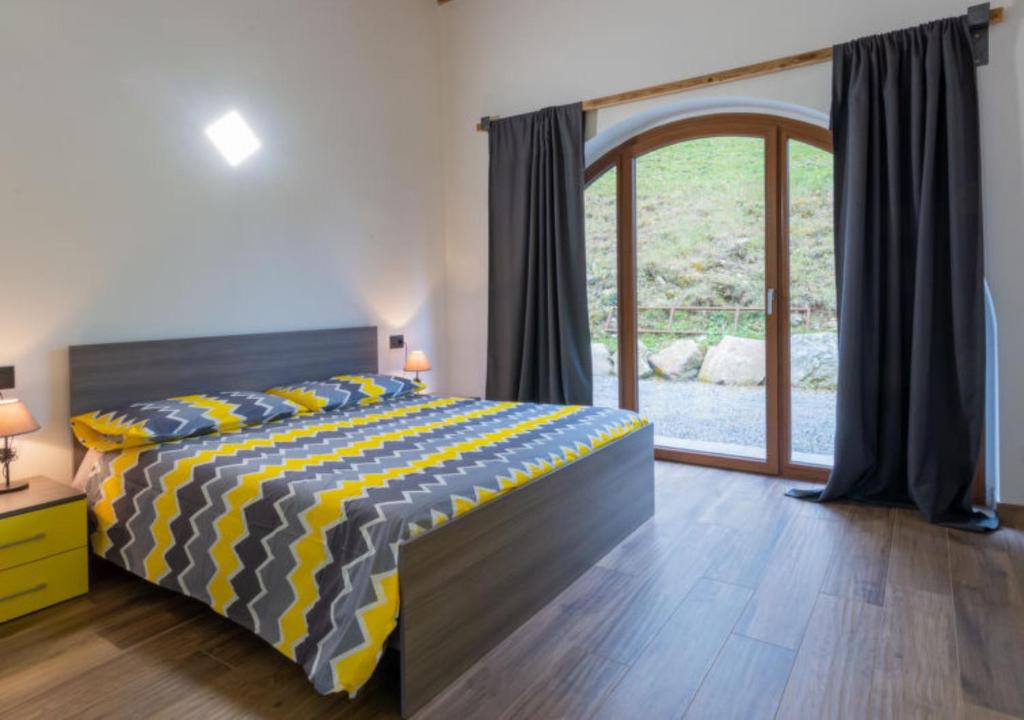 Postel nebo postele na pokoji v ubytování Agriturismo Baita Bavè