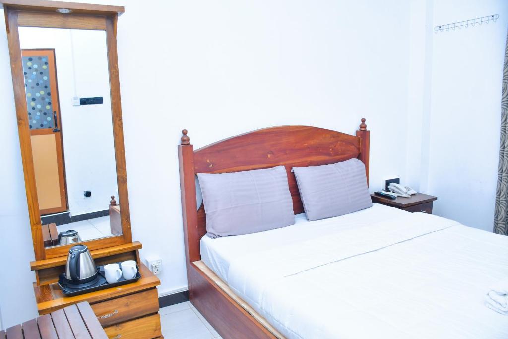 Postel nebo postele na pokoji v ubytování Ez Stay Guesthouse