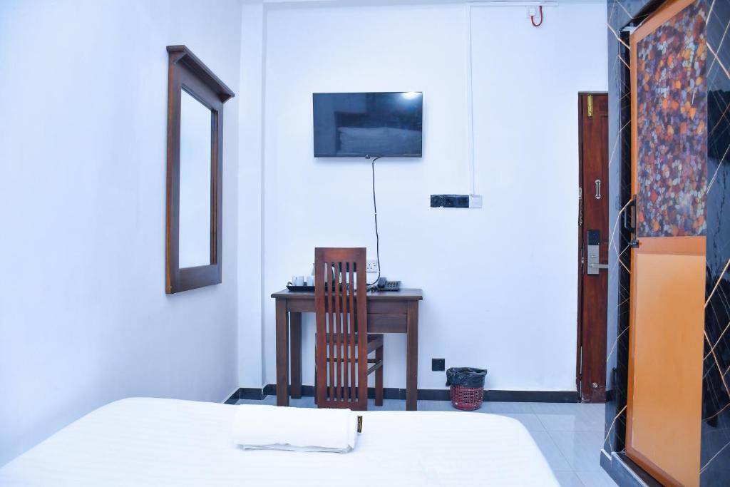 TV a/nebo společenská místnost v ubytování Ez Stay Guesthouse