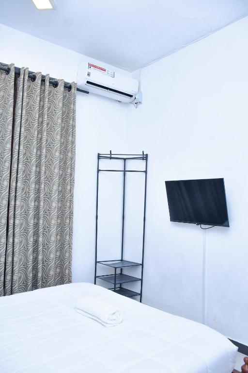 Postel nebo postele na pokoji v ubytování Ez Stay Guesthouse
