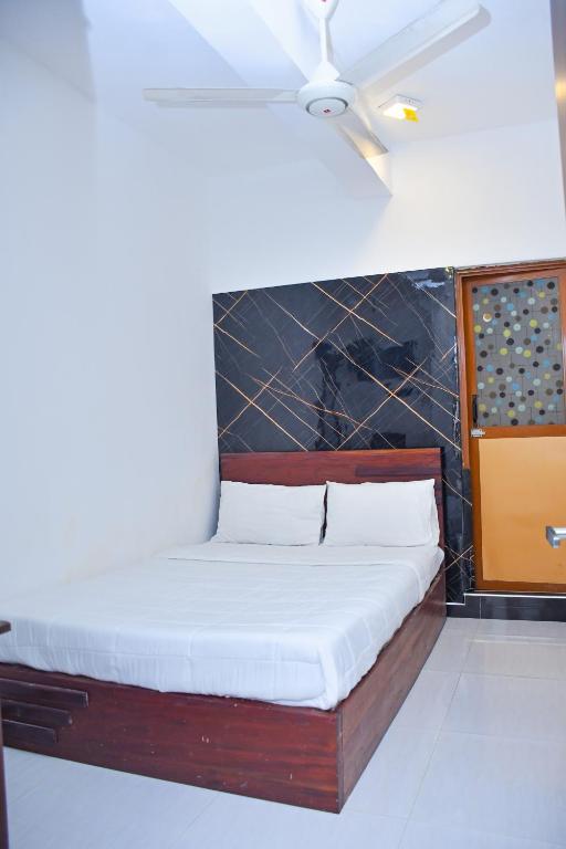 Postel nebo postele na pokoji v ubytování Ez Stay Guesthouse