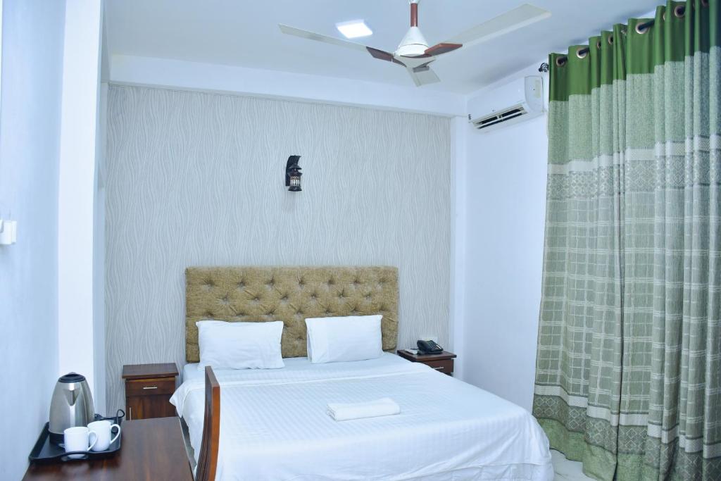 Postel nebo postele na pokoji v ubytování Ez Stay Guesthouse