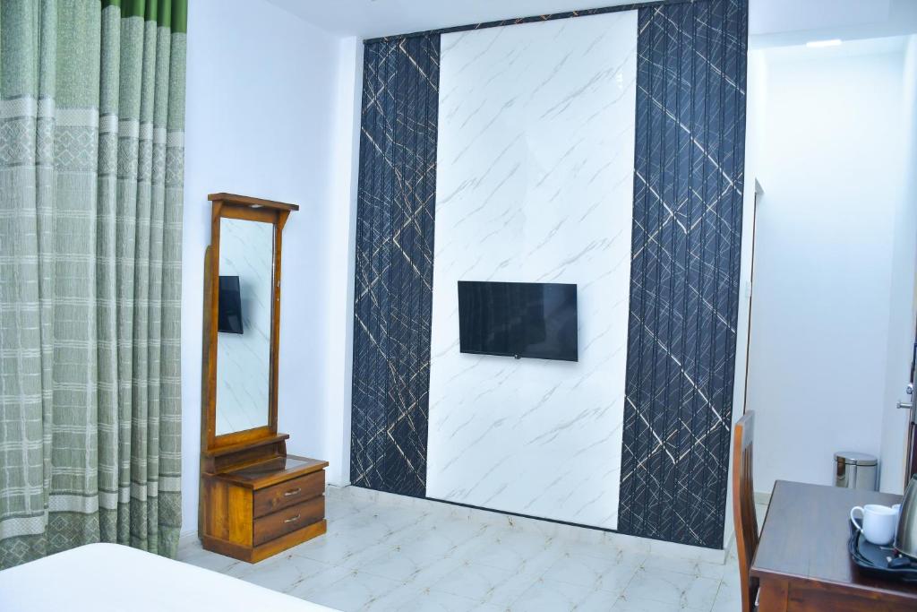 TV a/nebo společenská místnost v ubytování Ez Stay Guesthouse