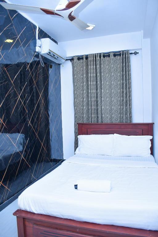 Postel nebo postele na pokoji v ubytování Ez Stay Guesthouse