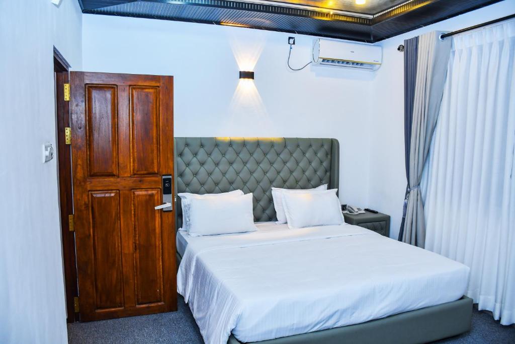 Postel nebo postele na pokoji v ubytování Ez Stay Guesthouse