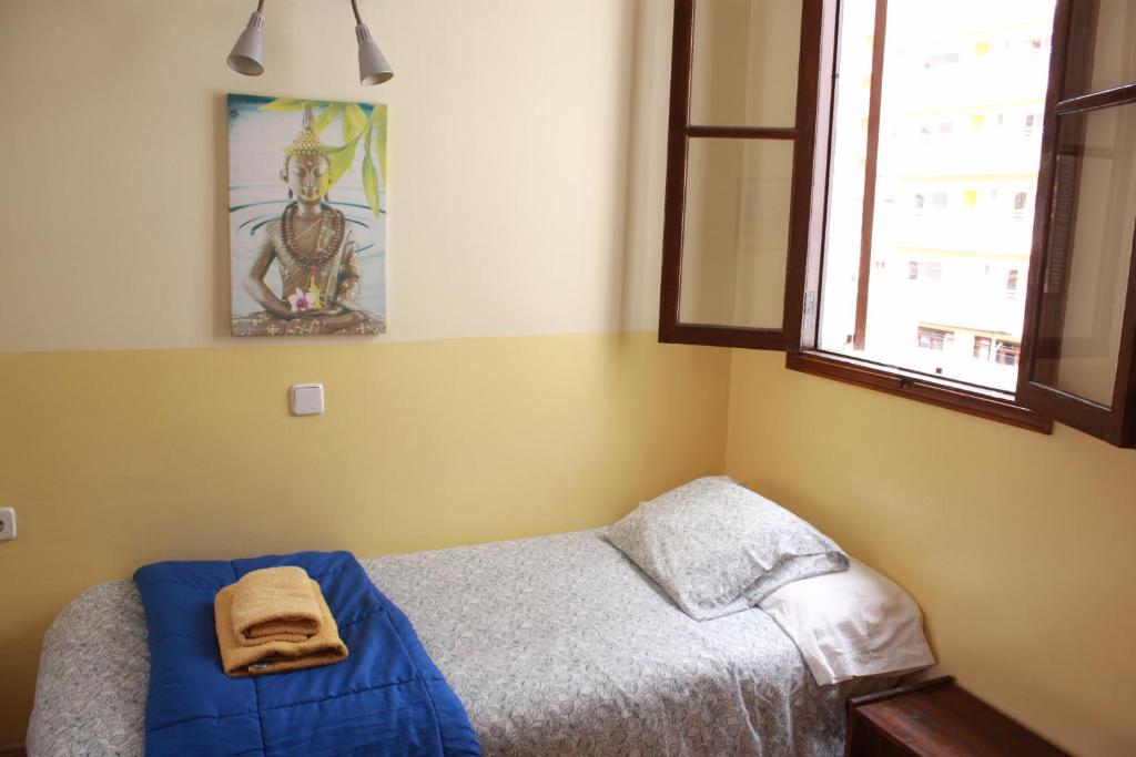 Postel nebo postele na pokoji v ubytování Hostal Atlanta