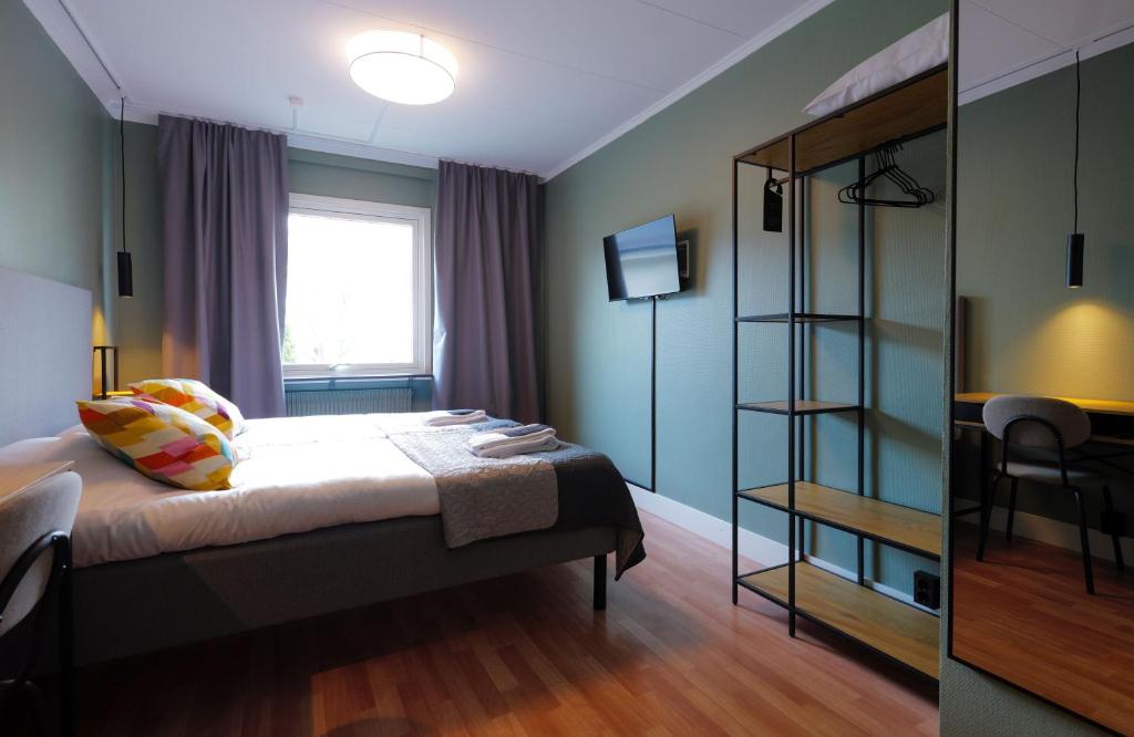 Postel nebo postele na pokoji v ubytování Hotell Veckefjärden